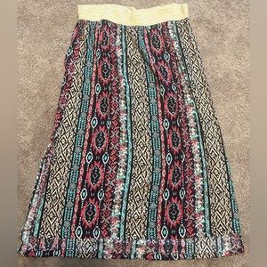 3x, worn once, lower in the back then the front, ankle length maxi skirt.